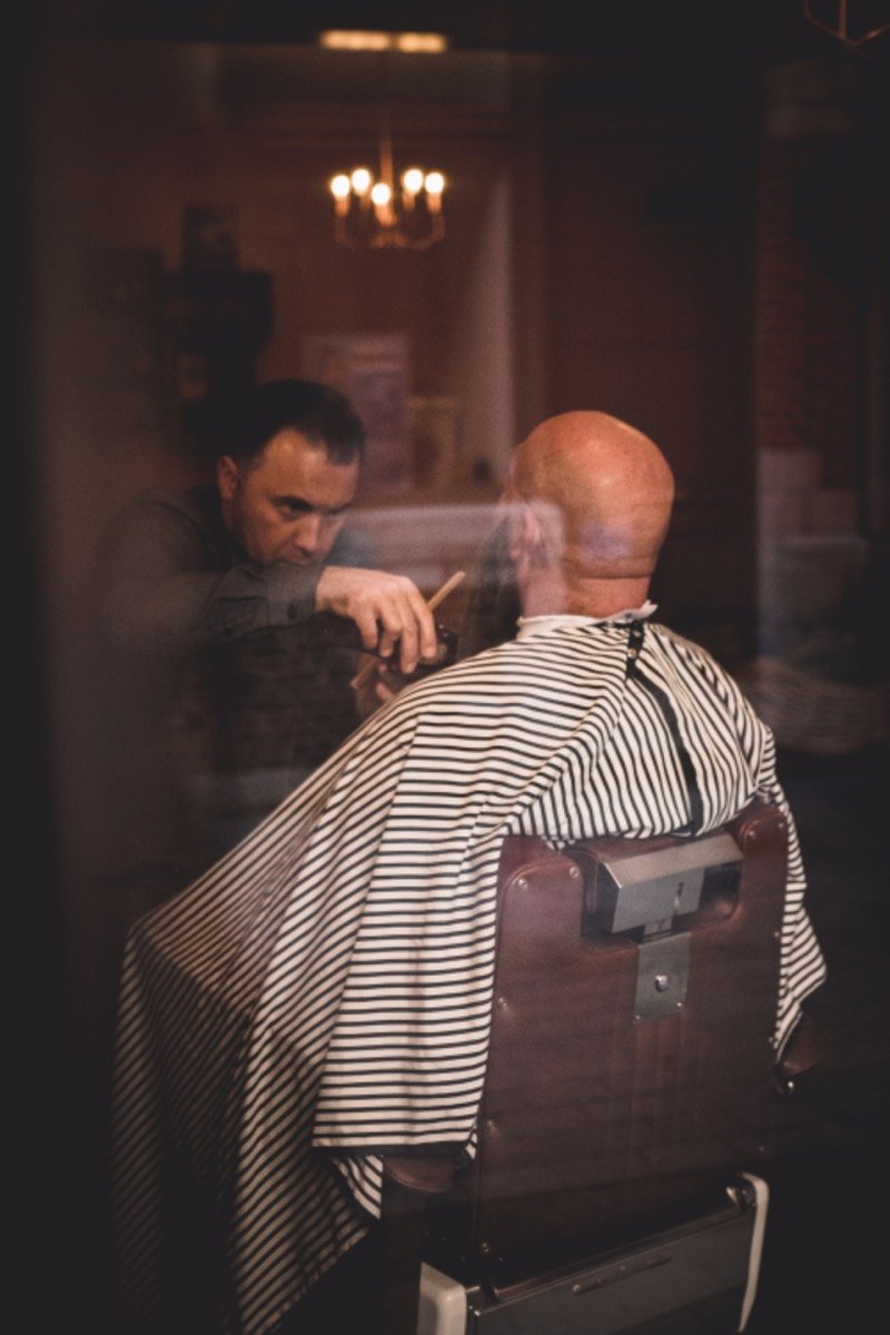Barber cutting a client's hair
