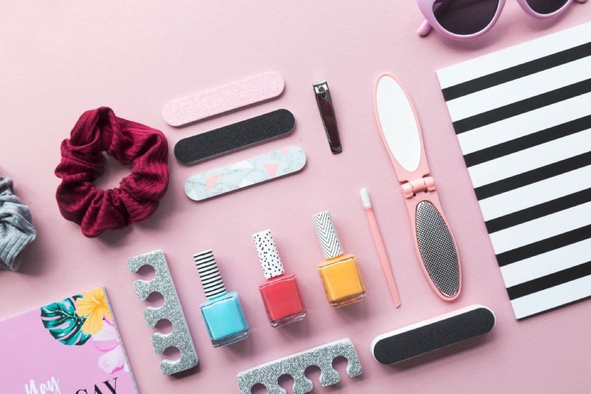 Pink beauty products laid out on a table